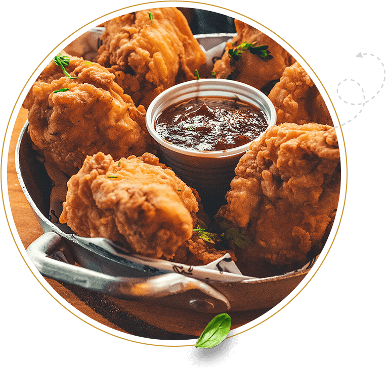 A bowl of fried food with dipping sauce.